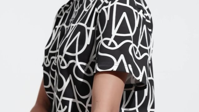 Camiseta Negra Con Gráfico De Adidas En Toda La Prenda Caliente