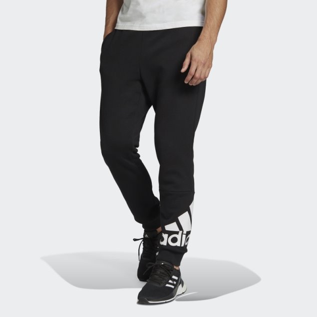 Pantalones Adidas Essentials De Forro Polar Con Puños Cónicos Negros