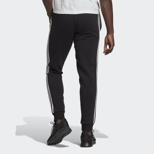 Pantalón Adidas Essentials De 3 Bandas Con Puños Ajustados Y Forro Polar Negro