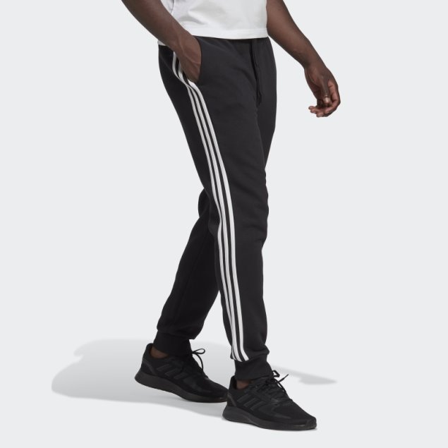 Pantalón Adidas Essentials De 3 Bandas Con Puños Ajustados Y Forro Polar Negro