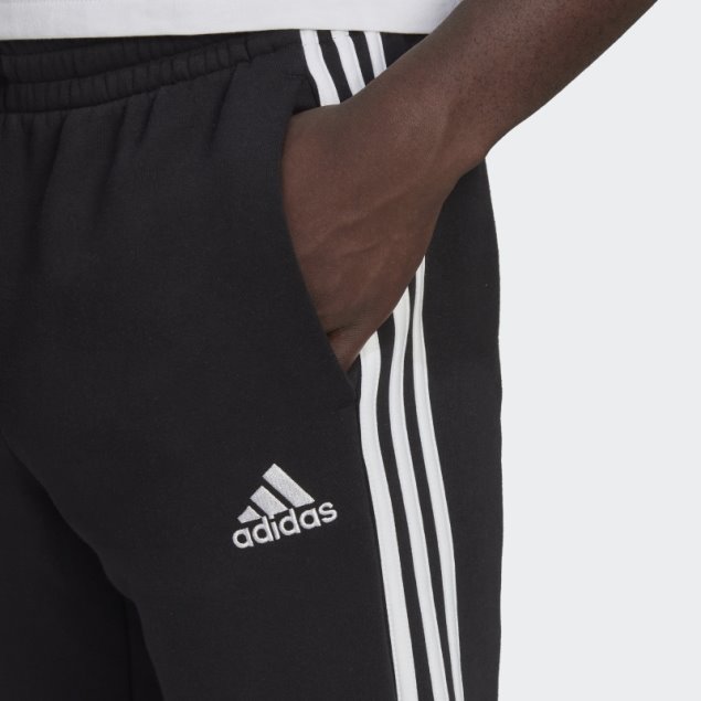 Pantalón Adidas Essentials De 3 Bandas Con Puños Ajustados Y Forro Polar Negro